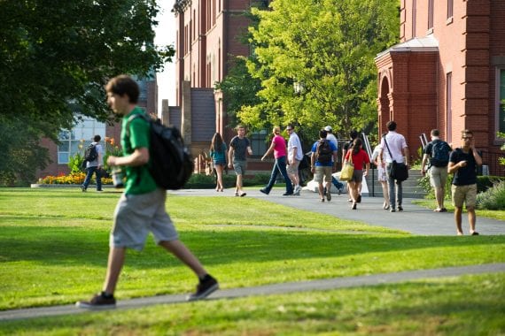 Students walking on the Tufts University campus.