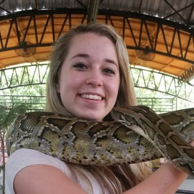 Jillian Morrell with a snake around her neck