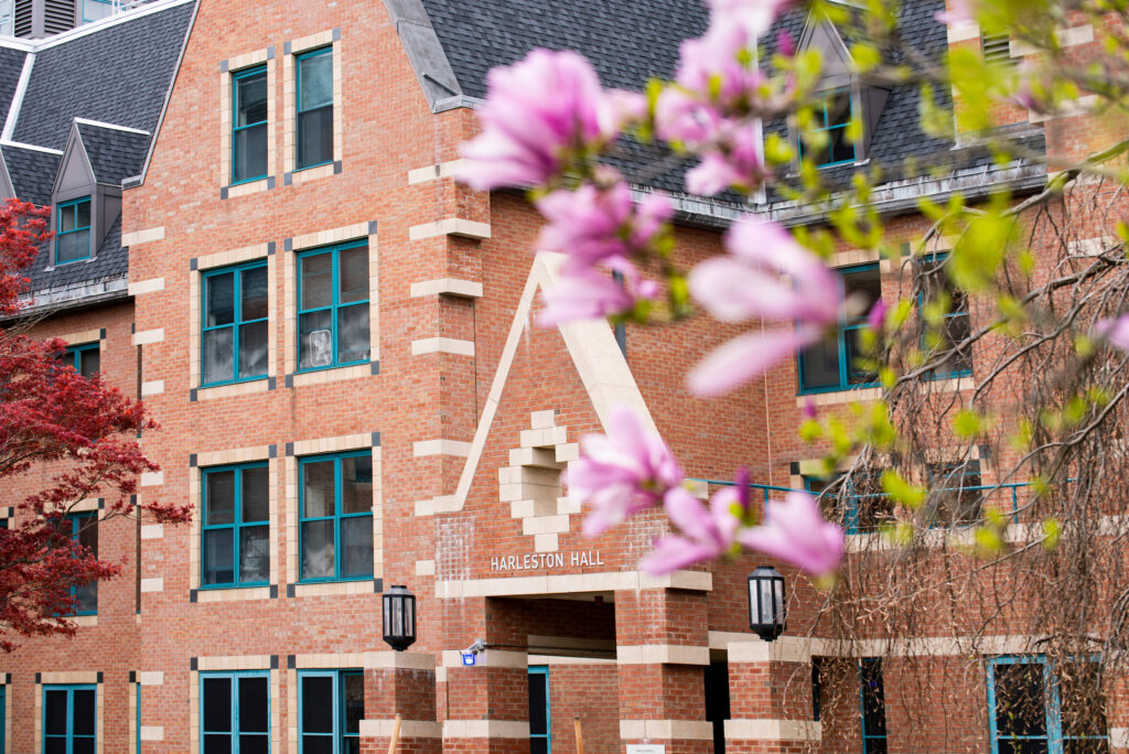 Harleston Hall is framed by flowering trees